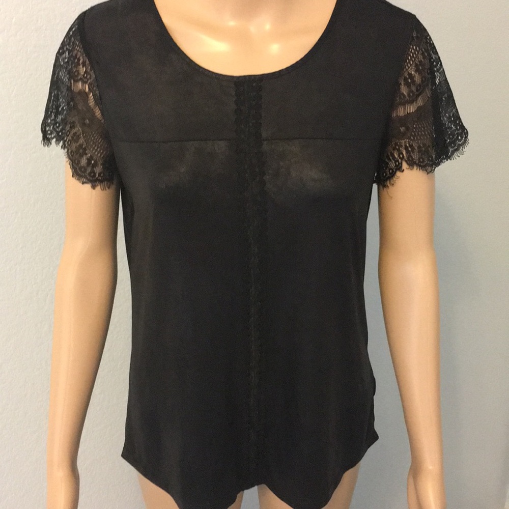Black pull over top with lace and leather look.